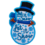 A snowperson wearing a top hat and a scarf. The words Let It Snow Let It Snow are stitched across the body.