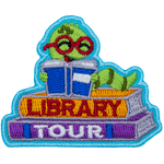A green bookworm reads a book on top of two books. The spines read Library Tour.