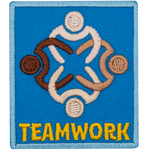 Four people with different skin tones link arms. The word Teamwork is below them.