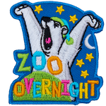 A yawning polar bear waking up from bed with the words Zoo Overnight.