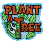 The words Plant A Tree are sewn in brown thread. Green leaves grow from them. One leaf has a curious face.