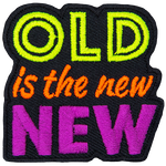 The words Old is the new New are stacked on top of each other and embroidered in neon colours.