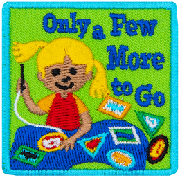 A young girl sews patches onto her sash. The words Only A Few More To Go are next to her.