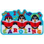 Three penguins dressed in different hats sing carols with Caroling stitched below them.