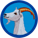 The side profile of a white goat with curved brown horns on a blue background.