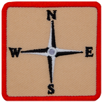This square patch displays a four-point compass rose showcasing only the four cardinal directions.