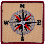 A sixteen-pointed compass with the letters N, E, S, W.