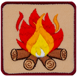 A campfire made out of red, orange and yellow flames and four logs.