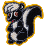 This adorable skunk is sitting on its hind legs with its forelegs tucked against its belly.