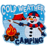 A camping snowman roasts a marshmallow over a campfire. The badge reads Cold Weather Camping.