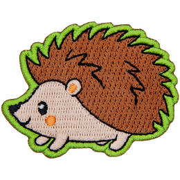 A cute hedgehog faces to the left.