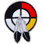A healing circle with two feathers.