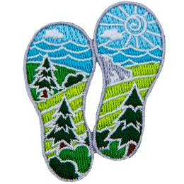 Two boot prints have images of nature within them. From the top down are the sun, clouds, waves, mountains, hills, forest, fields, and bushes.