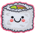 A piece of rice-coated sushi has a center of green, pink, and yellow. The sushi has a kawaii face.
