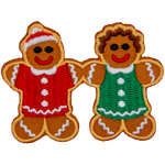 A gingerbread man and woman hold hands.