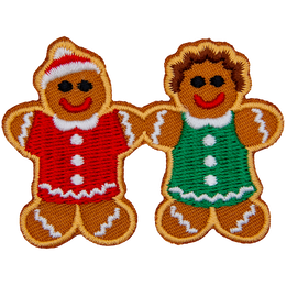 A gingerbread man and woman hold hands.