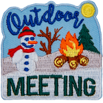 A snowman sits on a snow-covered hillside next to a roaring campfire. The text Outdoor Meeting frame the top and bottom of the patch.