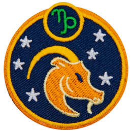 This circular crest has the side profile of a goat surrounded by stars. The sign of Capricorn sits above his head.
