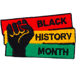 A fist pumps the air in solidarity with Black History Month.