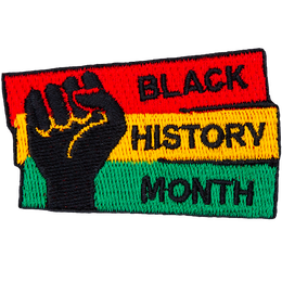A fist pumps the air in solidarity with Black History Month.