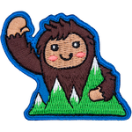 This happy bigfoot waves a warm welcome as they hold onto mountains.