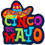 A sombrero sits on top of colourful letters that spell out Cinco de Mayo