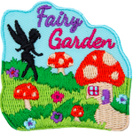 The words Fairy Garden above a lawn with mushroom houses and the silhouette of a fairy creature.