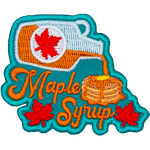 A bottle of syrup above the words Maple Syrup pours onto a pancake stack.