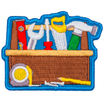 A toolbox filled with different tools such as a saw blade, screwdriver, wrench and level.