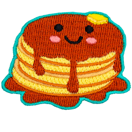 A stack of syrup-covered pancakes with a kawaii face.