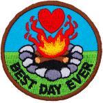 A campfire with a heart above it. The words Best Day Ever are in an arc across the bottom.