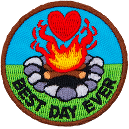 A campfire with a heart above it. The words Best Day Ever are in an arc across the bottom.