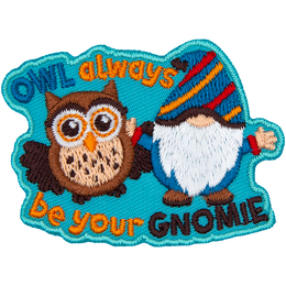 A blue gnome and a brown owl have their arms around each other. The words Owl Always Be Your Gnomie are around them.