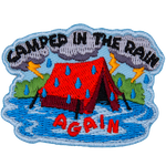 A red tent is caught in the rain. The words Camped In The Rain surround it.