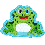 A green frog sits smiling with an open mouth at the viewer. 
