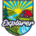 A round red tent sits in front of a setting sun. The word Explorer is in the foreground.