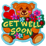An adorable teddy bear holds a bouquet of flowers, and the words Get Well Soon.
