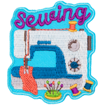 A white sewing machine stitching a piece of pink fabric sits under the word Sewing.