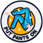 The legs of a figure pulling on a pair of jeans. The words Put Pants On are underneath.