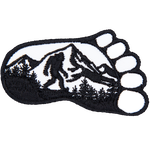 Bigfoot walking through the woods inside a footprint. 