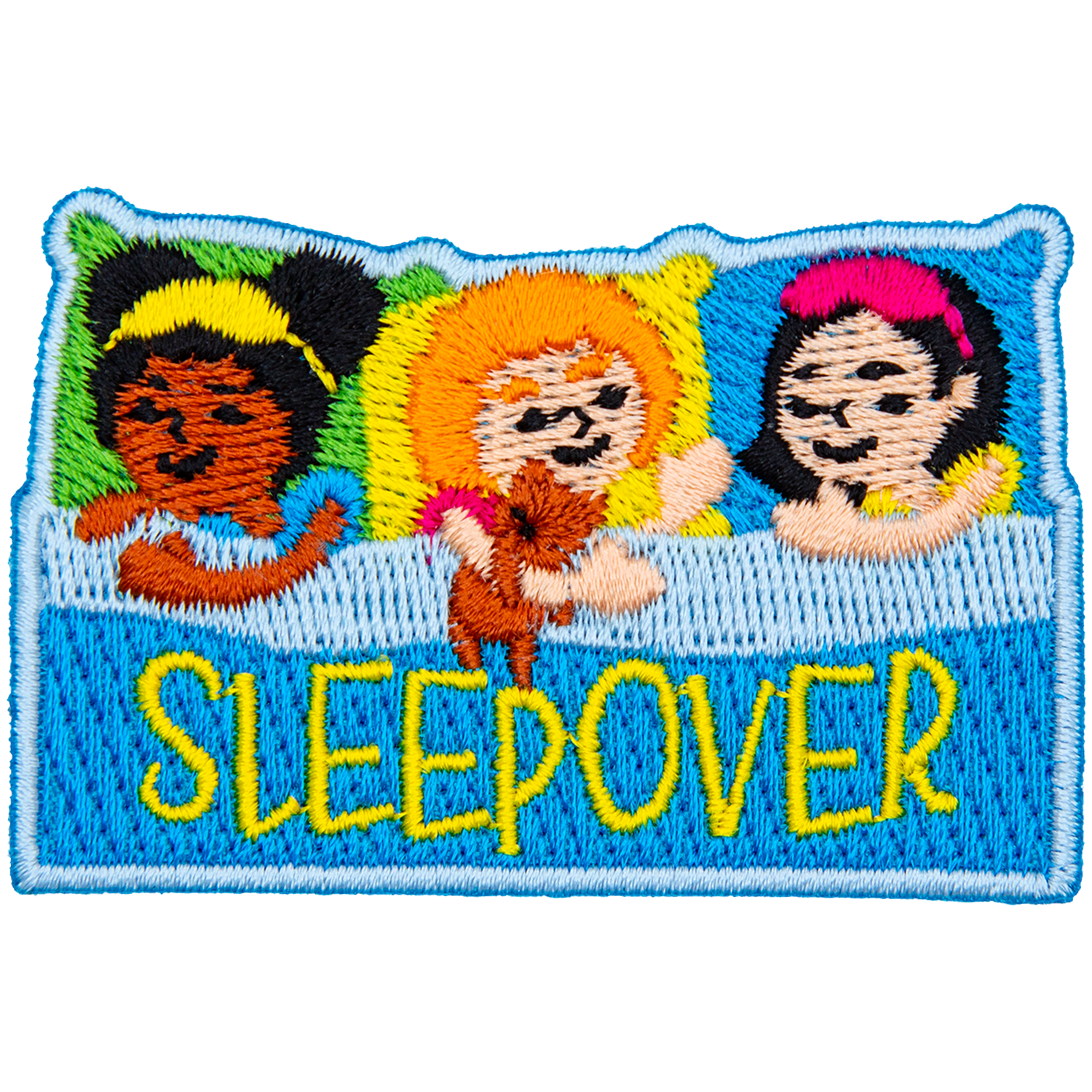 Three little girls are pretending to be asleep in bed. The word Sleepover is across the blanket.