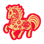 A gold horse with a red outline and floral details on its body.