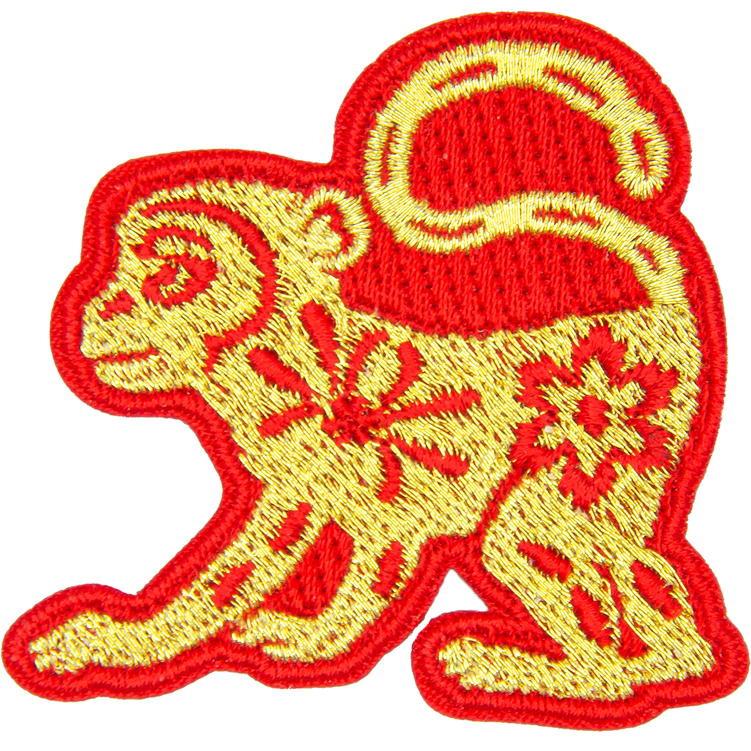 A gold monkey with a red outline and floral details on its body.