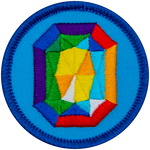 A rainbow gemstone on a blue background.
