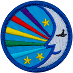 A sleeping moon with five rainbow strands coming out of it.