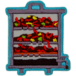 A layered vermicomposter with worms and compost inside of it.