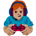 A red-haired person holding a controller, wearing a headset.