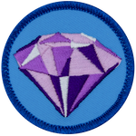 A sparkling purple amethyst on a blue background.