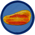 An amber gemstone on a blue background.
