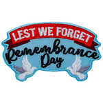 The words Lest We Forget Remembrance Day are held up by two white doves.